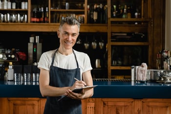 bar manager performing inventory