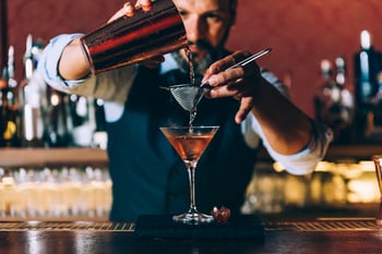 bartender pouring martini