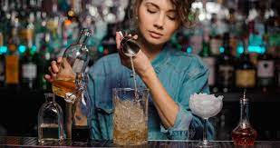 spot checking bar inventory on a shift when a bartender is pouring drinks