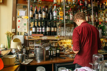 bartender counting inventory with a DIY bar inventory system