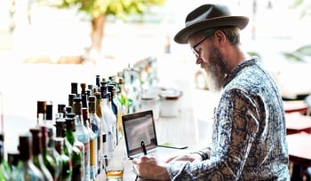 bartender performing a bar inventory count