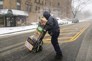 man delivering liquor to a local bar