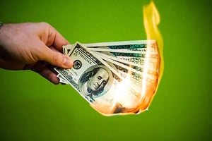 burning money symbolizing lost profits due to bar inventory shrinkage