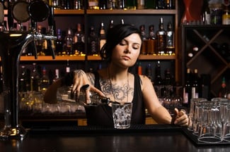 bartender pouring drinks based on an established pour size